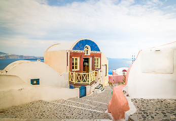 Image showing Typical colorful narrow street in Oia the most beautiful village of Santorini island