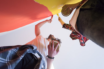 Image showing couple painting interior wall