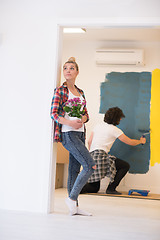 Image showing happy young couple doing home renovations