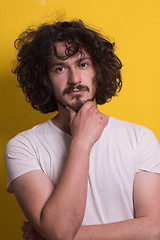 Image showing young man with funny hair over color background