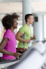 Image showing people exercisinng a cardio on treadmill