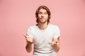 Image showing Beautiful male half-length portrait isolated on pink