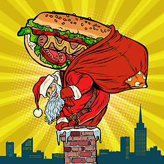 Image showing Santa Claus with a hot dog climbs the chimney. Food delivery