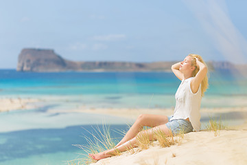 Image showing Relaxed Happy Woman Enjoying Sun on Vacations.