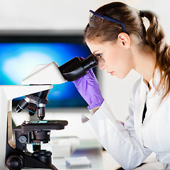 Image showing Portrait of a helth care professional microscoping.