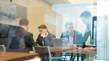 Image showing Business people sitting and brainstorming at corporate meeting.