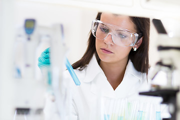 Image showing Female chemist working in scientific laboratory.