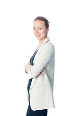 Image showing Business woman standing with arms crossed against white background.
