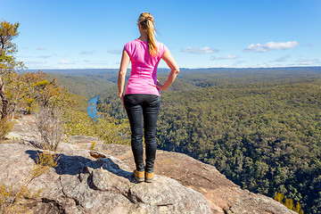 Image showing Bush walker admiring views high above the river