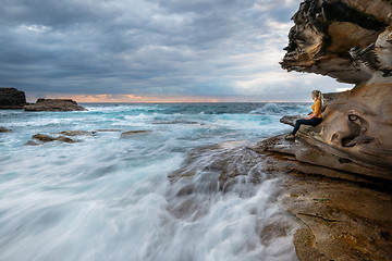 Image showing Watching the waves rush by, just like life