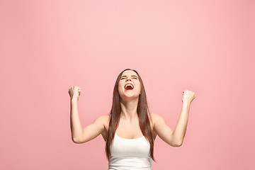 Image showing Winning success woman happy ecstatic celebrating being a winner. Dynamic energetic image of female model