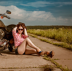 Image showing Biker girl and motorcycle