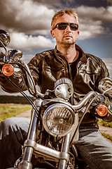 Image showing Biker on a motorcycle