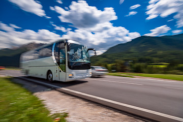 Image showing Tourist bus traveling on the road