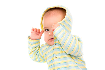 Image showing Little Baby isolated on white background. The baby hides his fac