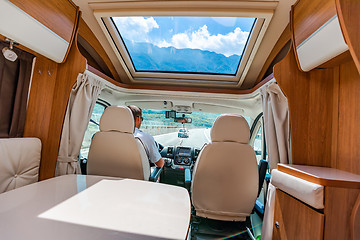 Image showing Man driving on a road in the Camper Van RV