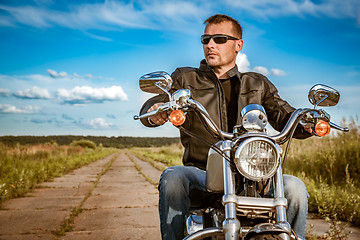 Image showing Biker on a motorcycle