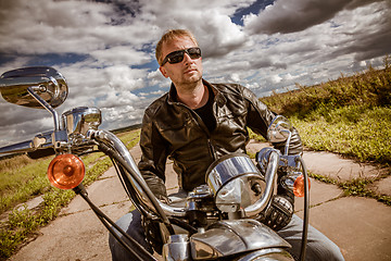 Image showing Biker on a motorcycle