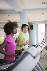 Image showing people exercisinng a cardio on treadmill in gym