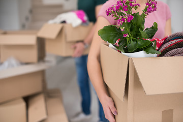 Image showing young couple moving into a new home