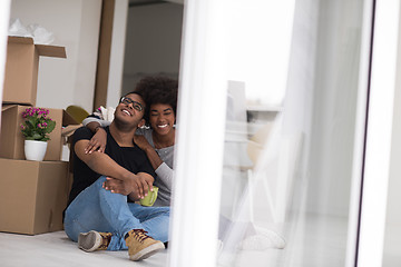 Image showing African American couple relaxing in new house