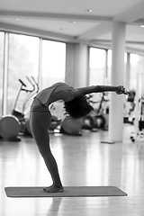 Image showing african american woman exercise yoga in gym