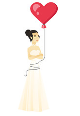 Image showing Serious bride with a heart-shaped red balloon.