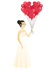 Image showing Bride with bunch of heart-shaped red balloons.