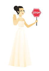 Image showing Asian fiancee holding stop road sign.