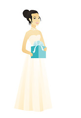 Image showing Woman in a white bridal dress holding a gift box.