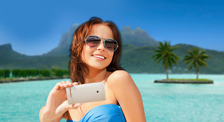 Image showing woman taking selfie by smartphone on bora bora