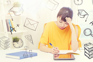 Image showing bored asian woman student with tablet pc at home