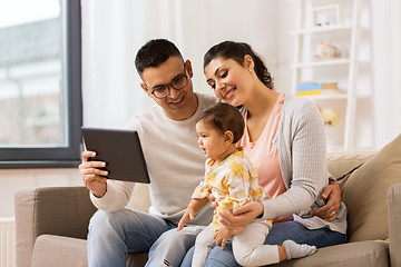 Image showing mother, father and baby with tablet pc at home