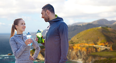 Image showing couple of sportsmen with water over big sur coast