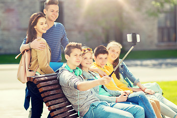 Image showing happy teenage students taking selfie by smartphone