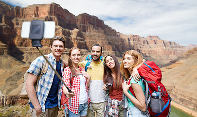 Image showing happy travelers taking selfie at grand canyon