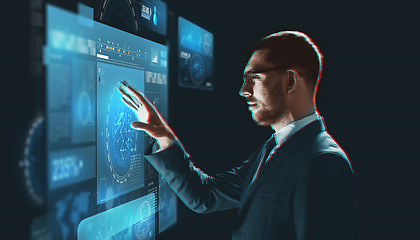 Image showing businessman torching virtual screen projection