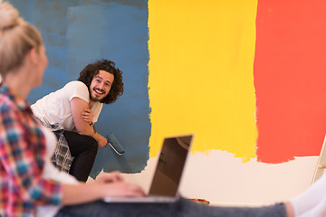 Image showing Happy couple doing home renovations