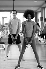 Image showing couple  workout with weights at  crossfit gym