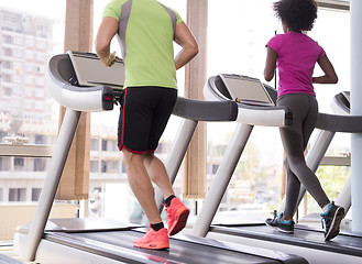 Image showing people exercisinng a cardio on treadmill in gym