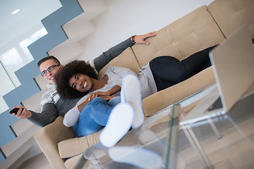 Image showing multiethnic couple relaxing at home