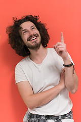 Image showing young man with funny hair over color background