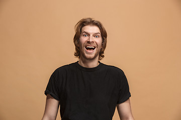 Image showing The happy business man standing and smiling against pastel background.