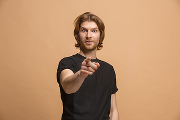 Image showing The happy business man point you and want you, half length closeup portrait on pastel background.