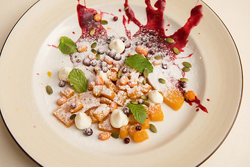 Image showing Tasty dessert from pumpkin and sea-buckthorn