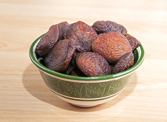 Image showing Dried apricots in an oriental bowl