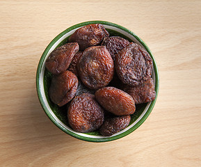 Image showing Dried apricots in an oriental bowl