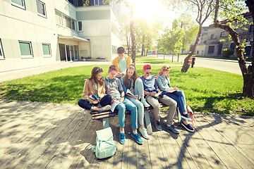 Image showing group of students with notebooks at school yard