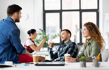 Image showing creative team drinking coffee at office