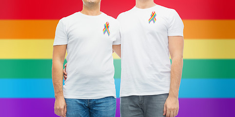 Image showing close up of couple with gay pride rainbow ribbons